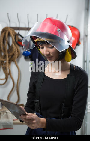 Smiling female architect using digital tablet Stock Photo