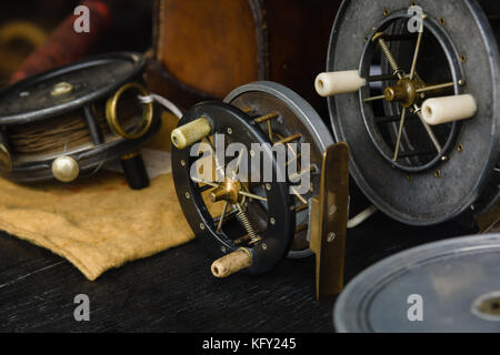 Vintage fly reels typically used for coarse or freshwater fishing for salmon or trout in rivers and lakes ideal for an angling background or article Stock Photo