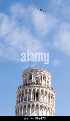 Pisa, Italy - October 28th, 2017: A Ryanair budget airliner flies above the leaning tower of Pisa in Italy on a beautiful autumn day Stock Photo