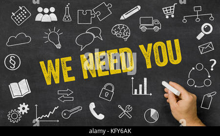 We need you written on a blackboard with icons Stock Photo