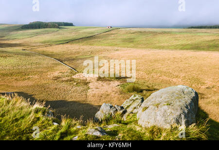 View from Peel Crags across bog and farmland in Northumberland National Park in autumn near Hexham, Northumberland, UK. Stock Photo