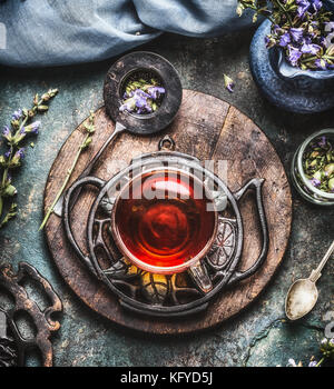 Herbal tea concept  with vintage tools and glass cup, top view Stock Photo