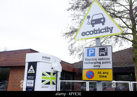 An electric vehicle charging point and parking space at a motorway service station in the UK.