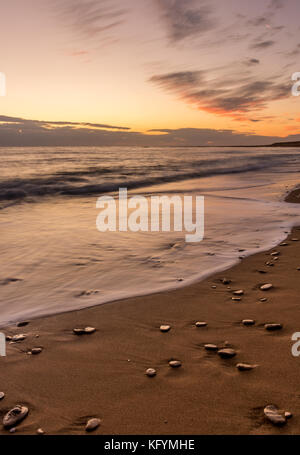 Pebbles on the beach at South Corfu Greece during sunset. Stock Photo