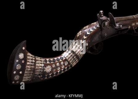 Afghan cap rifle with beautiful nacre decoration. The 19th century. Path on the black background. Stock Photo