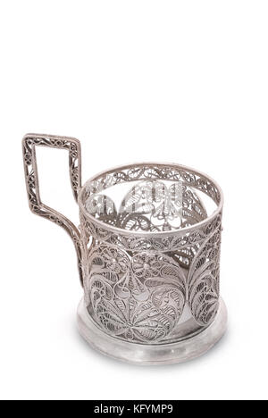 Vintage silver glass holder. Very useful and very popular thing in old Russia and USSR thing for holding hot tea glass (especially during travel in tr Stock Photo