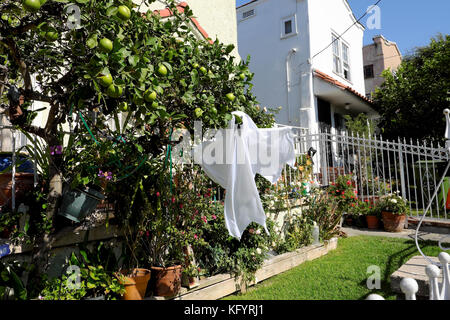 Halloween ghost hanging from a  outside a home in Echo Park, East Los Angeles, California USA  KATHY DEWITT Stock Photo