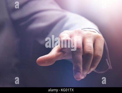 Businessman pressing an imaginary button Stock Photo