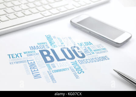 Blog concept cloud chart print document, keyboard, pen and smartphone. Stock Photo