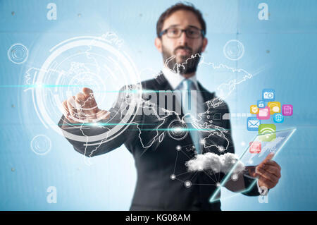 Businessman standing and working with touch screen technology  - Earth map from: http://eoimages.gsfc.nasa.gov/images/imagerecords/57000/57730/land oc Stock Photo