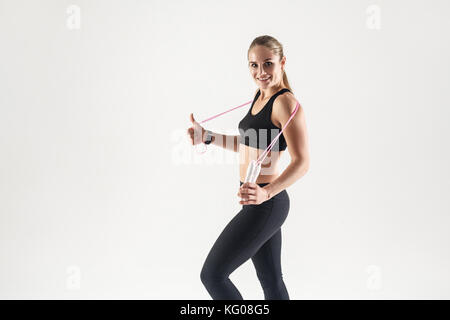 Athletic black girl exercising with skipping rope at park Stock Photo -  Alamy