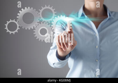 Businesswoman in front of visual touch screen. Stock Photo