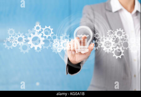 Businesswoman in front of visual touch screen. Stock Photo