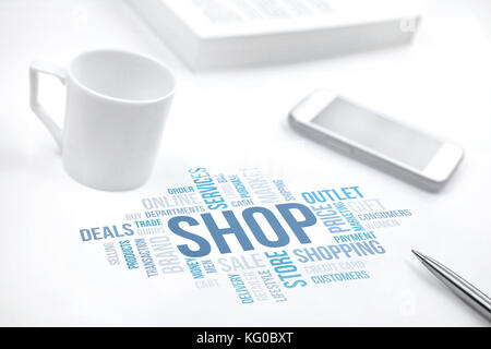 Shop concept word cloud print document, smartphone, book, pen and coffee cup. Blue toned Stock Photo