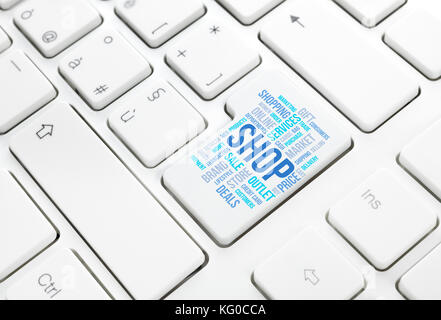 Shop business concept word cloud in enter button or key on white keyboard Stock Photo