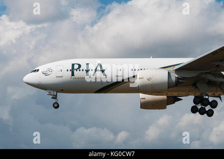 LONDON, UK - AUGUST, 3 2013; A Pakistan International Airlines (PIA) Boeing 777-240(ER) lands at Heathrow Airport in London Stock Photo