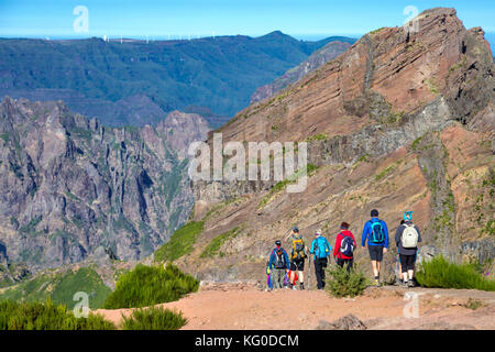 Hikers taking off from Pico do Arieiro on the trail towards Pico Ruivo - the highest peak in Madeira, Portugal Stock Photo