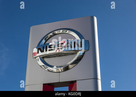 Nissan sign logo outside a car dealership Stock Photo