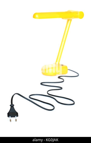 Electric plug with long black cable and yellow desk lamp on white background Stock Photo