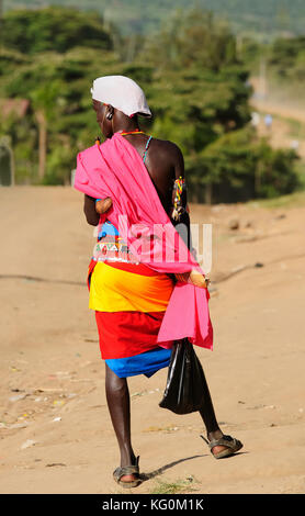 MARALAL, KENYA - JULY 03: Young warrior from the Samburu tribe in the traditional dress in transit to the market in the Maralal town in Kenya, Maralal Stock Photo