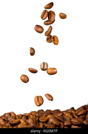 roasted coffee beans, food and drinks,  falling on heap of coffee, isolated on white background Stock Photo