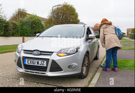 Car driver stopping to ask for directions in the UK. Stock Photo