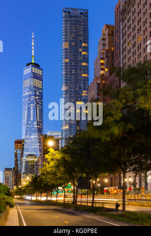 The One World Trade Center and the newly constructed 50 West skyscrapers from West Street at twilight. Manhattan Lower Manhattan, New York City Stock Photo