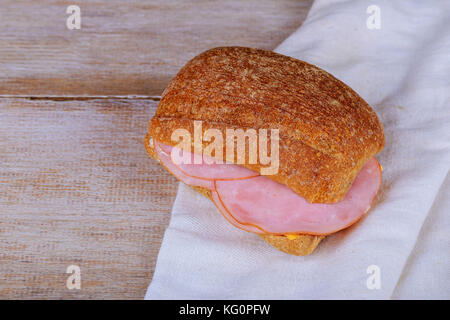fresh sandwich on a white with texture ham sandwich on the table Stock Photo