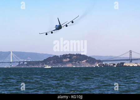 Boeing 747-400 (N121UA) makes a low pass over San Francisco Bay in October of 2017. Stock Photo