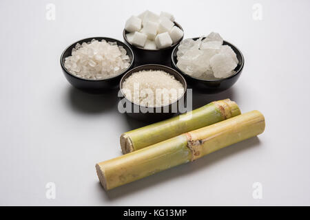 Jaggery, Sugar Variety and Sugarcane - by-products of Sugar Cane or Ganna placed over moody background. Selective focus Stock Photo