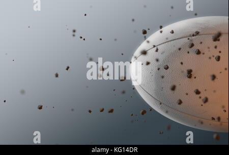 A dirty white rugby ball caught in slow motion flying through the air scattering dirt particles in its wake - 3D render Stock Photo