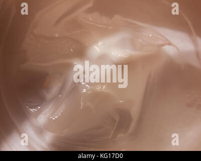 close up of white cream moisturizer inside glass tub; essex; england; uk Stock Photo