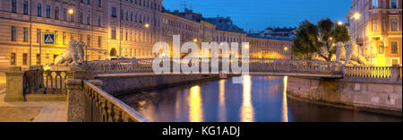 Night view on illuminated Griboedov Canal and Lions Bridge, St. Petersburg, Russia Stock Photo