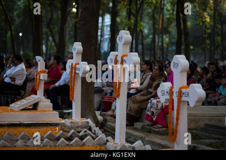 Dhaka, Bangladesh. 02nd Nov, 2017. Bangladeshi Christian devotees observe All Souls' Day, known as the Feast of All Souls, Commemoration of all the Faithful Departed in Dhaka, Bangladesh on 02nd November 2017.  On this day, Christians come to the graveyard and pray for the departed souls of their loved ones..All Soul's Day is a Roman Catholic day of remembrance for friends and loved ones who have passed away. This comes from the ancient Pagan Festival of the Dead, which celebrated the Pagan belief that the souls of the dead would return for a meal with the family. Credit: zakir hossain chowdhu Stock Photo