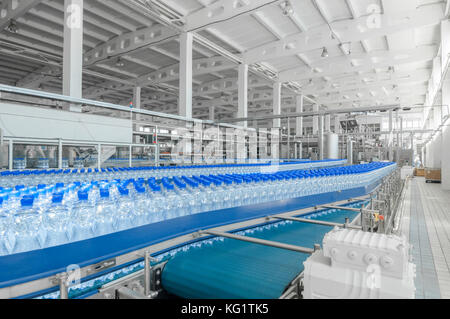 for the production of plastic bottles and bottles on a conveyor belt factory Stock Photo