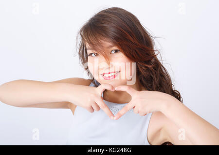 Studio portrait of attractive teenage girl Stock Photo