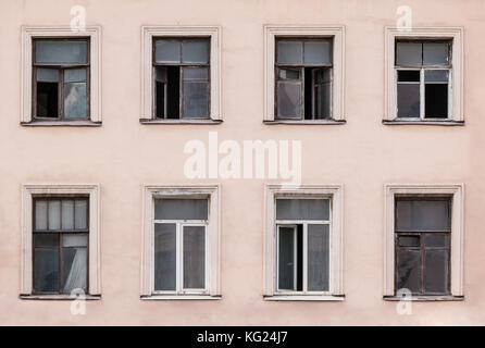 Several windows in a row on facade of urban apartment building front view, St. Petersburg, Russia Stock Photo