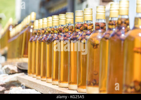 Details of bottles of grappa, a typical liquor, San Romerio Alp, Brusio, Canton of Graubunden, Poschiavo Valley, Switzerland, Europe Stock Photo