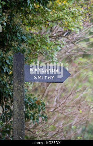 Waylands Smithy signpost in autumn. Neolithic chambered long barrow along the Ridgeway, Ashbury, Oxfordshire, England. Stock Photo