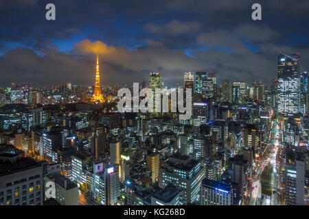 Elevated night view of the city skyline and iconic illuminated Tokyo Tower, Tokyo, Japan, Asia Stock Photo