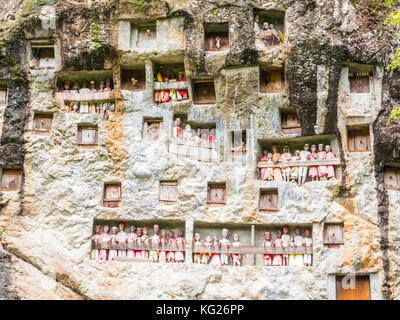 Galleries of tao-taos interspersed with the doors to family crypts, Tana Toraja, Sulawesi, Indonesia, Southeast Asia, Asia Stock Photo