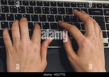 Close-up of typing female hands on keyboard. Stock Photo