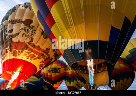 Inflating hot air balloons with flame, Albuquerque International Balloon Fiesta, Albuquerque, New Mexico USA Stock Photo