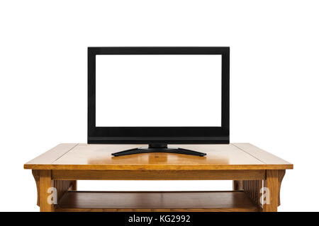 Flat screen television with cut out screen on large table isolated on white. Stock Photo