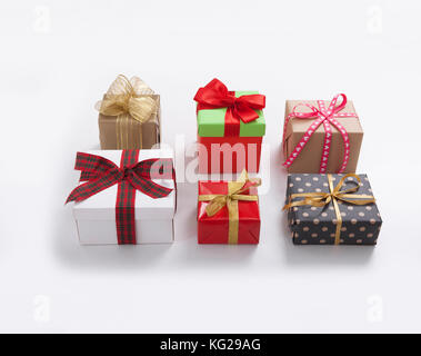 Gift boxes on white background top view. Wedding invitation, greeting card for Mother's Day. Beautiful birthday invitation. Selective focus. Stock Photo