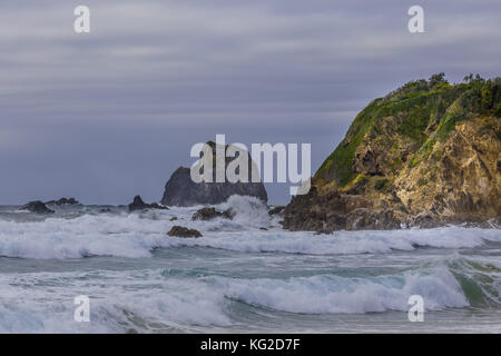 Glasshouse rocks at Narooma ocean coastline in stormy weather Stock Photo