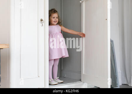 Cute girl in closet Stock Photo