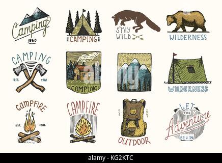 set of engraved vintage, hand drawn, old, labels or badges for camping, hiking, hunting with mountains, campfire and tent, axes. bear and backpack, wolf or red fox. Stock Vector