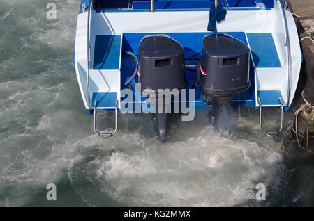 Boat engines tune up  rear view of speed boat running. Stock Photo