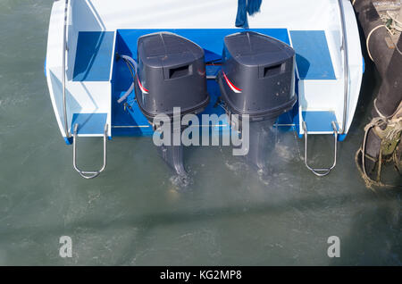 Boat engines tune up  rear view of speed boat running. Stock Photo